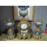 A FRENCH GILT BRASS AND PORCELAIN CLOCK GARNITURE 19th Century the rectangular arched case with