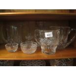 A COLLECTION OF WATERFORD CUT GLASS to include three jugs, sugar bowls, table lamp,