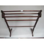 A GOTHIC STYLE PINE FIVE BAR TOWEL RAIL on scroll legs