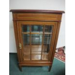 A MAHOGANY AND SATINWOOD INLAID DISPLAY CABINET of rectangular outline the shaped moulded top above