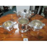 A THREE PIECE SHEFFIELD PLATED TEA SERVICE with ebonised handle