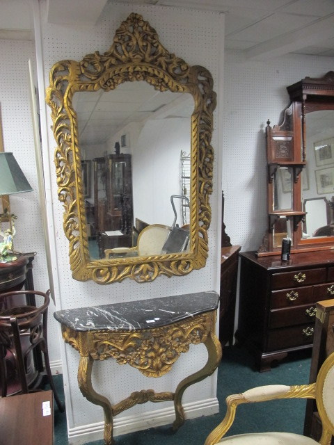 A CONTINENTAL GILTWOOD AND MARBLE CONSOLE TABLE AND MIRROR the rectangular plate within a pierced