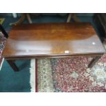 A STAINED BEECHWOOD COFFEE TABLE the rectangular top above a plain apron on moulded legs 42cm (h) x