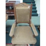 AN EDWARDIAN MAHOGANY GENTS CHAIR the arched top rail above an upholstered panel and seat on lobed