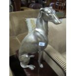 A COMPOSITION FIGURE modelled as a greyhound shown seated 53cm high