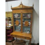 A VERY FINE AND IMPRESSIVE PAIR OF SATINWOOD AND POLYCHROME DISPLAY CABINETS each with a dentil