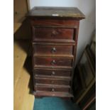 A PINE GRADUATED CHEST of six drawers with brass ring handles