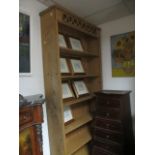 A PINE SIX TIER OPEN FRONT BOOKSHELF with pierced cresting 95cm x 196cm x 26cm