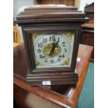 A STAINED BEECHWOOD MANTLE CLOCK of rectangular form with silvered and brass dial raised on a