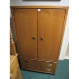 A DREXEL WALNUT TWO DOOR TV AND VIDEO CABINET with panel doors the base containing two long drawers