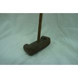 19th/20thC hickory shafted putter with a shaped, composite head and copper plates to top and bottom