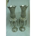 Iranian silver .840 pair of candle light holders with pierced and chased decoration and twelve drops