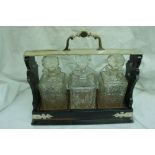 Elkington & Co. EPNS & coromandel tantalus with three silver labels on decanters (no key)