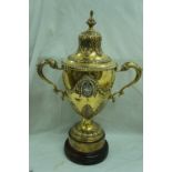 GIII silver gilt two hand urn and cover with finial, acanthus to top, wreath and gadrooned border,