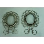 Pair of Mexican silver oval photo frames with bead surrounds, height 3.5ins