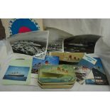 A collection of papers, brochures, photographs etc all about RMS Queen Mary