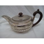 GIII circular silver chased and half-fluted tea-pot, London 1808, maker PI.F 19 ozt.