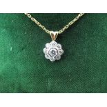 18ct gold flower-shaped diamond cluster pendant on an 18ct gold chain