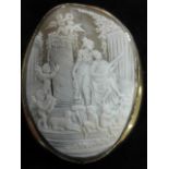 Large oval 9ct gold frame cameo brooch showing figures in a garden. Ht. 2.75 ins.