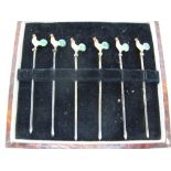 Set of six sterling silver cocktail sticks with enamel tops. Cased