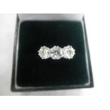 Good, three-stone diamond ring set in 18ct white gold, size P/Q. Insurance value £7,500