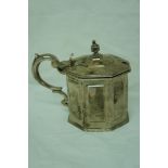 Early Victorian octagonal silver mustard pot with urn finial to lid, scroll handle, London 1843,