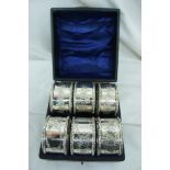 Set of six late Victorian silver napkin rings with floral decoration cased, Chester 1897, Maker F.W