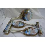 Early 20thC Continental enamel and silver five piece dressing table set with decoration of