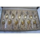 Cased set of twelve Continental Art Deco silver gilt coffee spoons marked .800