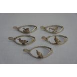 Set of five GV silver napkin rings in the form of wish-bones with game birds prominent. Birmingham