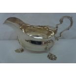 GV silver sauce boat with shaped border, shell handle, shell knees and foot, Birmingham 1923,