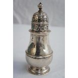 GV silver Georgian style sugar shaker with ball finial dome lid, baluster belted body on raised