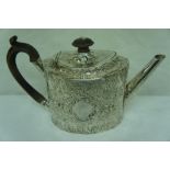 GIII oval chased silver tea pot with fruitwood finial and handle, floral and acanthus decoration