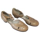 Semi-formal shoes worn by legendary actress Greta Garbo. Tan leather flats feature a buckle