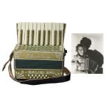 Shirley Temple's personally-owned accordion, given to her by a fan. Wood-framed accordion with