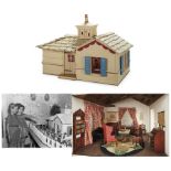 Shirley Temple's very own large dollhouse, measuring 43'' x 26'' x 26''. Wooden bungalow style