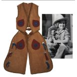 Shirley Temple cowboy outfit, worn for the 1936 Texas Centennial. Outfit comprises suede chaps