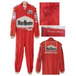 Emerson Fittipaldi signed red racing suit, worn during the peak of his career in the early 1990's.