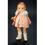 Shirley Temple's very own doll, resembling herself, of a girl on ice skates, circa 1932. Effanbee-