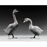 Pair of French Patinated Lead Geese, 19th c., one standing upright with neck outstretched, the other