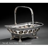 Sheffield Plate Cake Basket in the Classical Taste, 19th c., pierced shell border, swing handle, paw
