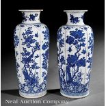 Pair of Chinese Blue and White Porcelain Rouleau Vases, probably 19th c., decorated with bird?on?