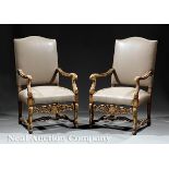 Pair of Continental Renaissance?Style Carved and Gilded Fauteuils, 19th c., arched crest,