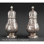 Pair of Continental Silver Castors in the Louis XVI Taste, late 19th c., French import marks,