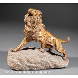 James Andrey (French, active early 20th c.), "Roaring Lion", bronze on carved naturalistic stone