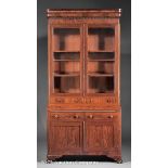 American Late Classical Carved Mahogany Secretary Desk, mid?19th c., ripple molded cornice, glazed