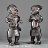 Pair of African Bronze Figures, standing male and female couple modeled wearing wrapped skirts and