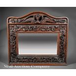 American Renaissance Carved Oak Mirror, late 19th c., arched crest centering an angelic bust,