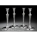 Set of Four Neoclassical Silverplate Candlesticks, c. 1810, bead decorated border with paneled