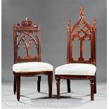 Two American Gothic Carved Rosewood Slipper Chairs, mid?19th c., one crested with volute scrolls,